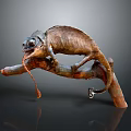 Lifelike Brown Chameleon Perched On Tree Branch With Extended Tongue And Curled Tail