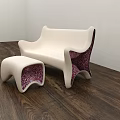 Modern Public Chair Featuring White Sleek Surface And Pink Patterned Accents With Matching Ottoman