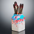 Paintbrushes in Colorful Vase With Blue Red White Paint Splatters On Dark Background