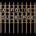 Wooden Decorative Screen With Circular Holes Displaying LA FOLIE DU BURGER