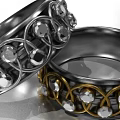 Elegant Silver And Gold Rings With Intricate Braided Design And Sparkling Gemstones