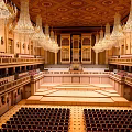 Grand Concert Hall With Crystal Chandeliers And Ornate Seating
