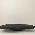 Modern Black Coffee Table With Smooth Surface And Unique Curved Shape