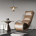 Brown Leather Lounge Chair With Metal Frame Side Table Coffee Cup And Book