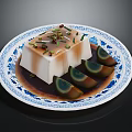 Fresh Green Herbs Garnishing Silky Tofu On Blue And White Patterned Plate With Sauce