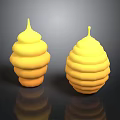 Two Yellow Spiral Stacked Sculptures With Reflective Bases On Dark Surface