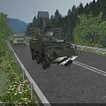 Multiple Green Military Functional Vehicles with Weapon Systems Driving on Road in Mountain and Trees