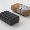 Black Leather Ottoman And Brown Chevron Patterned Ottoman With Gray Striped Blanket