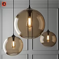 Modern Amber Glass Globe Pendant Lights Three Hanging Over Gray Paneled Wall