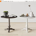 Dark and White Side Tables with Carved Bases and Decorative Green Bowl White Pitcher