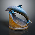 Detailed Leaping Dolphin Sculpture With Wave Textured Base And Metallic Finish