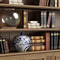 Classic Wooden Bookcase With Carved Top And Shelves Filled With Books Vases And Decorative Items