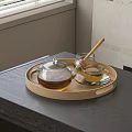 Cozy Glass Tea Set with Wooden Tray Honey Jar and Teacup on Table Near Window