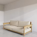 Minimalist Two Seater Sofa With Beige Cushions And Wooden Frame In Bright White Living Room