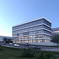 Modern Glass Curtain Wall Office Building With Multiple Floors Surrounding Road And Greenery