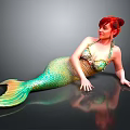 Red Haired Woman In Green And Yellow Mermaid Tail Lying On Black Smooth Surface