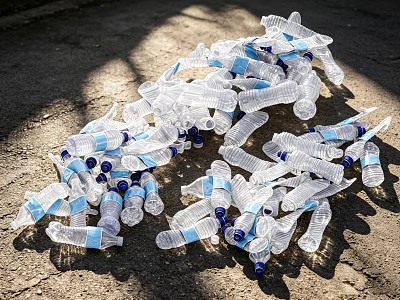 Sunlit Transparent Plastic Bottles With Blue Caps Scattered On Ground 3d model