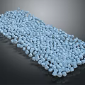 Light Blue Small Stones Arranged In A Long Strip On Dark Background