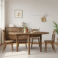 Cozy Wooden Dining Chairs Around Round Table in Bright Natural Room with Window Plants