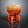 Decorative Stool With Beige Padded Seat Riveted Edge And Orange Carved Legs
