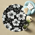 Round Black and White Floral Pattern Carpet in Living Room with Blue Chair Potted Plant