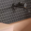 Modern Black Faucet on Dark Hexagonal Tile Backsplash with Pink Sink 3d model