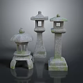 Three Variously Designed Stone Lanterns With Mossy Surfaces On Reflective Dark Background