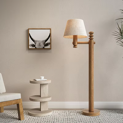 Living Room With Wooden Floor Lamp Beige Fabric Shade Bull Head Wall Art And Minimalist Side Table 3d model