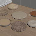 Round Floor Cushions With Various Woven And Fabric Textures On Wooden Floor