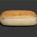Fresh Golden Crusty Bread Loaf With Soft Interior On Black Surface