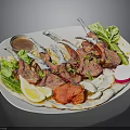 Grilled Lamb Chops With Fresh Lettuce Lemon Slice Tomato And Sauce On Plate