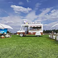 Garden Landscape With Green Lawn Ice Cream Truck White Tents And Outdoor Seating