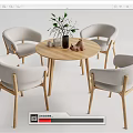 Modern Round Wooden Dining Table With Four Light Gray Fabric Chairs And Decorative Vase