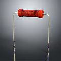 Red Resistor With Metal Leads As Essential Electronic Hardware Tool