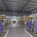 Warehouse Interior With Shelves Cardboard Boxes Blue Signs And Wide Aisle