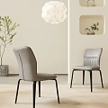 Two Modern Light Gray Dining Chairs With Black Legs In Minimalist Room With Pendant Light