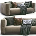 Comfortable Sectional Sofa With Gray Brown Pillows And Cozy Knit Blanket 3d model