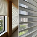 White Window Blinds Filtering Light With Natural View Of Green Trees And River