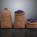 Three Burlap Sacks Filled with Fresh Purple Fruits on Dark Surface