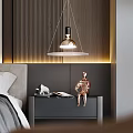 Modern Bedside Table With Copper Statue Open Book Warm Lighting And Hanging Pendant Light