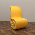 Yellow Modern Accent Chair With Unique Curved Design On Wooden Floor And Gray Wall