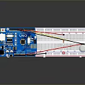 Blue Arduino Development Board With Breadboard LED Sensor And Colored Wires