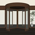 Modern Bronze Revolving Door With Glass Panels And Indoor Plant
