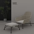 Modern Woven Single Chair With Light Cushion And Matching Ottoman Near Green Plant