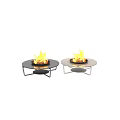 Round Garden Fire Tables With Burning Firewood And Black Metal Frames