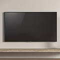 Black Television Mounted on Wall with Wooden Shelf and Golden Cylindrical Speakers on Both Ends