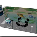 Colorful Exhibition Booth With Green Nature Backdrop Cartoon Characters Tables Chairs And Display Screen