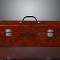 Red Textured Toolbox With Black Handle And Silver Latches On Shiny Surface