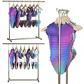 Swimwear On Hangers With Various Colors And Styles Displayed On Rack