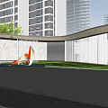 Modern Entrance Gate With Orange Sculpture Black Pavement And Lawn Among High Rise Buildings